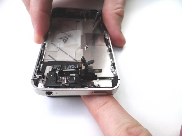 Picture 1: With your left hand, gently pinch the digitizer and LCD cables (attached to the display assembly).  With your right hand, align the mid-frame with the display assembly.