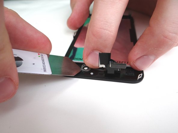 Picture 1: There should be a plastic ring covering the front-facing camera (on the mid-frame).