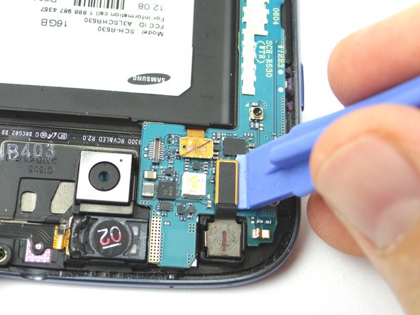 Picture 1: Use the Blue Pry Tool to release the front-facing camera cable.