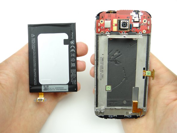 Place the battery in ZONE IV, adhesive side up.