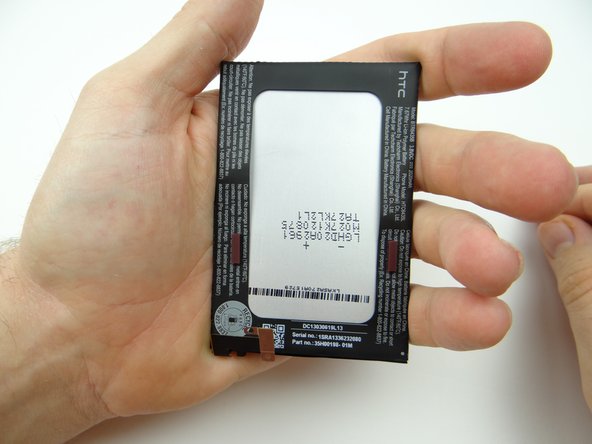 Place battery in ZONE V, adhesive side up.