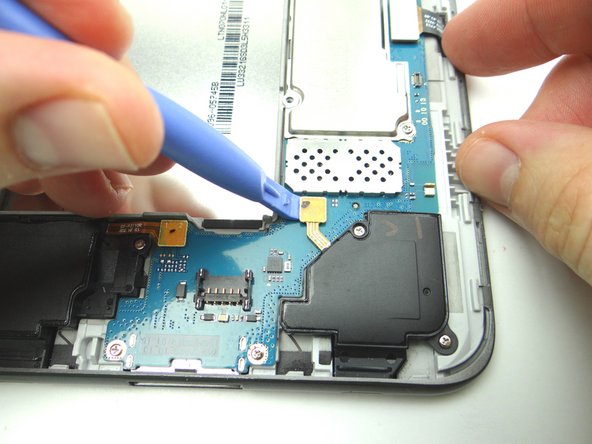 Remove four 3.4 mm #00 Phillips screws.  Place in SLOT 1.