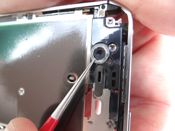 If necessary, reattach the plastic ring to the front-facing camera.  Use the Fine Point Tweezers to line tabs on the ring up with the slots on the frame.