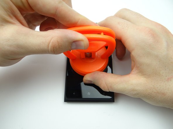 Picture 1: Place a large suction cup in the center of the screen.