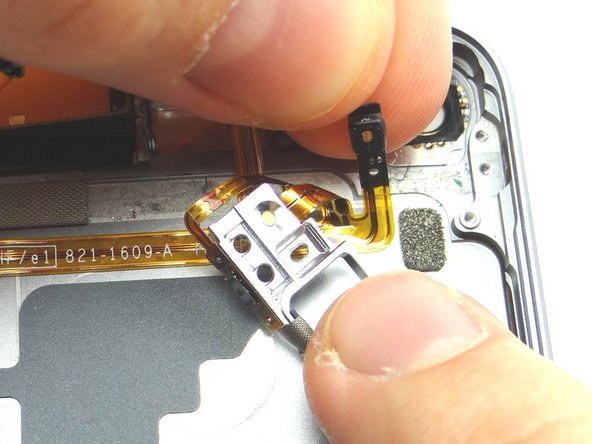 Grab the microphone with your fingers and continue peeling up