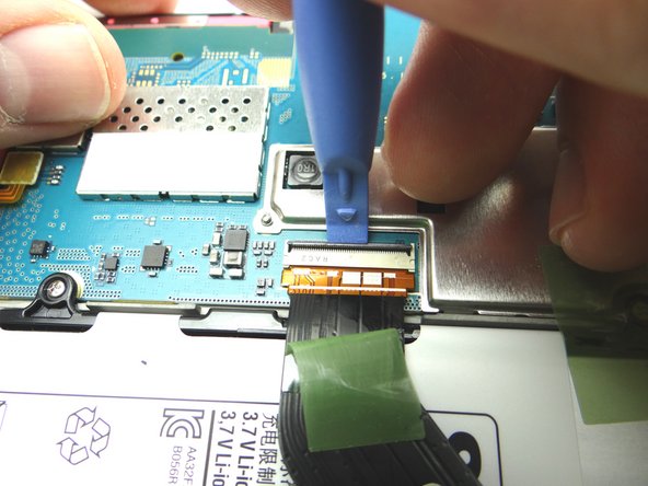 Picture 2: Use blue pry tool to lift ZIF connector black bar into open position.