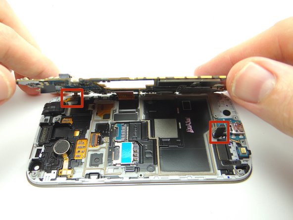 Guide charging port and headphone jack cables above the logic board.