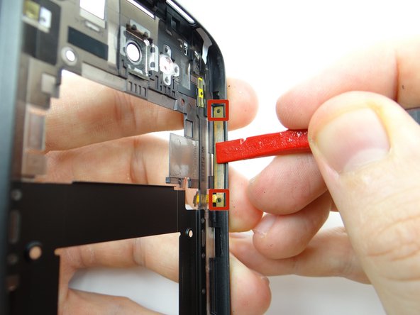 Seat the ends of the cable over the tabs (red squares) then push firmly into place.