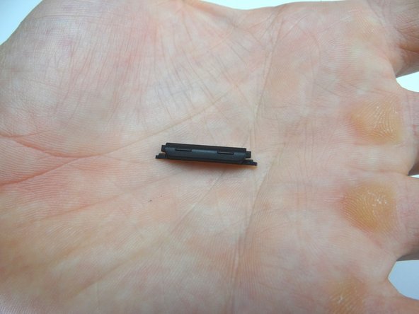 Gently lift volume rocker.  Place in COMPARTMENT A.