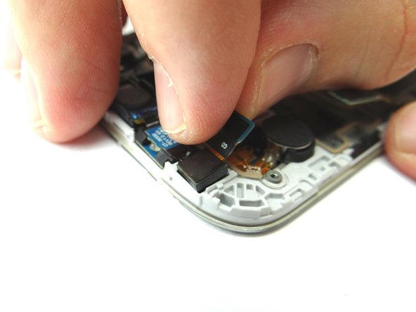 Picture 1: Use your fingers to remove the front-facing camera and place into COMPARTMENT D.