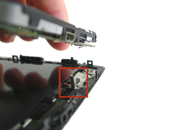 Picture 1: Continue lifting the top half of the logic board up from the display.