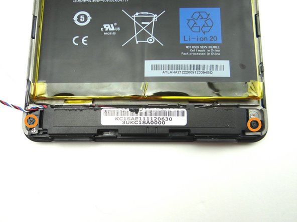 Remove two 3.3 mm Phillips #00 screws securing the speaker assembly.  Place in SLOT 1.