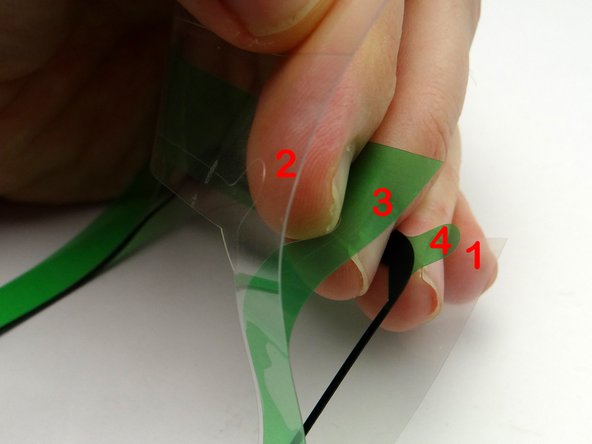 Picture 1: The adhesive has an inner backing, labelled '1', and three layers of cutout backing, labelled '2', '3' and '4' .