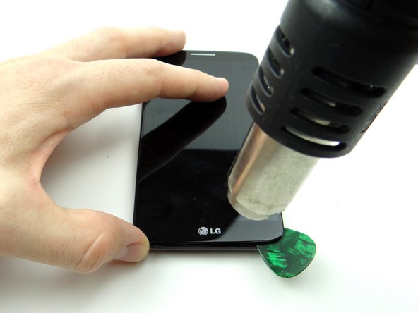 Pictures 1 &amp; 2: Reheat the lower edge for an additional 30 seconds.  Insert a second guitar pick.