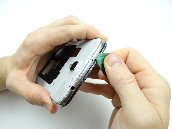 Picture 3: Release the clips along the top edge of the mid-frame.