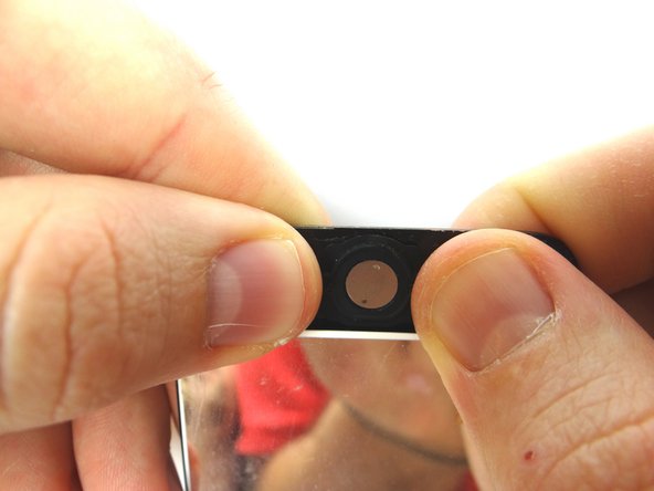 Picture 2: On the backside, press home button into place and smooth out any wrinkles in the rubber.