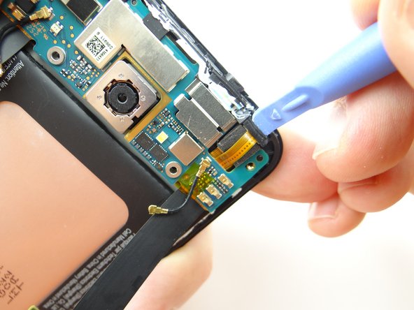 Dislodge microphone, but don't try to remove it.