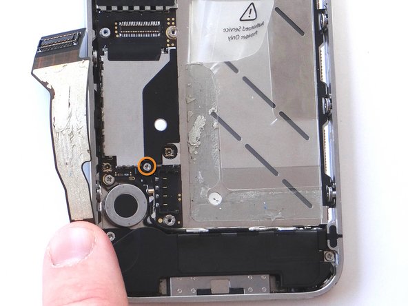 Picture 1: Remove 1.6 mm Phillips screw securing L-Shaped antenna shield.  Place the screw in SLOT 9.