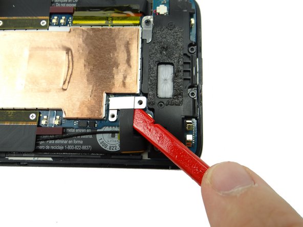 Use flat end of spudger to disconnect battery, approaching it from the angle in the picture.