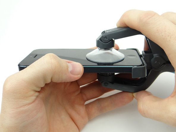 Picture 1: Close the iSclack suction cups on either side of the iPhone.
