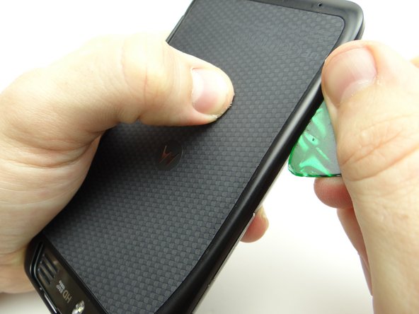 Work your way across the bottom, then up the opposite side to continue releasing clips.