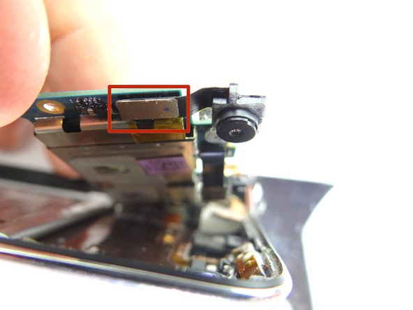 Pictures 2 &amp; 3: Use the spudger to disconnect the rear camera.