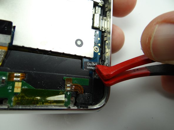 Use plastic tweezers to peel up 'Do not remove' sticker.