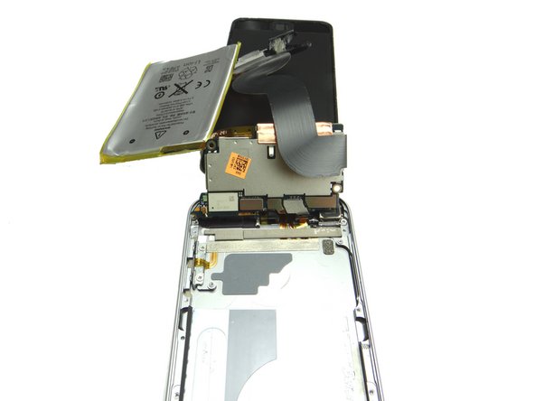 Picture 3:  With the underside of the logic board exposed, rest the battery and charging port assembly by the screen.