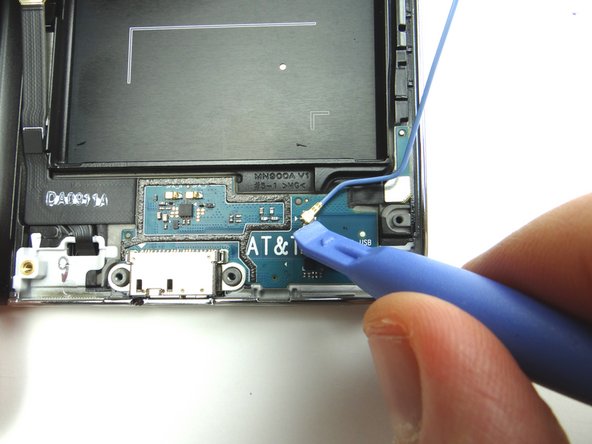 Disconnect the antenna cable using the blue pry tool and place it in ZONE IV.