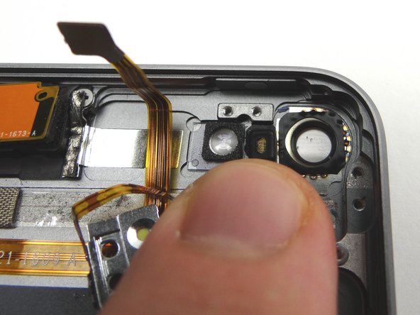 Picture 2: Seat microphone, but don't seat the volume buttons bracket or rear camera socket.