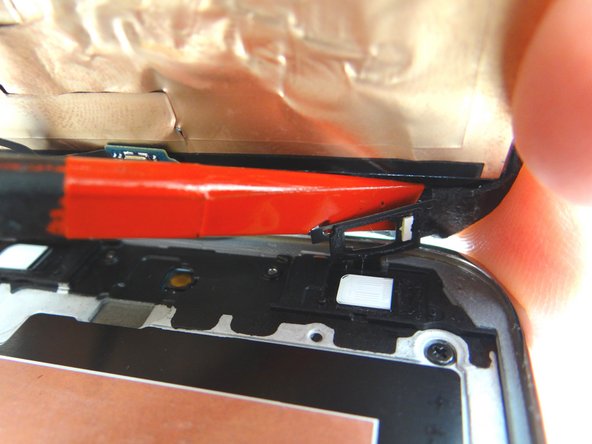 Picture 2: The escape and multitask soft key spacers may still be attached to the screen.  Use a spudger to pull them free.  Leave the home button attached to the screen.