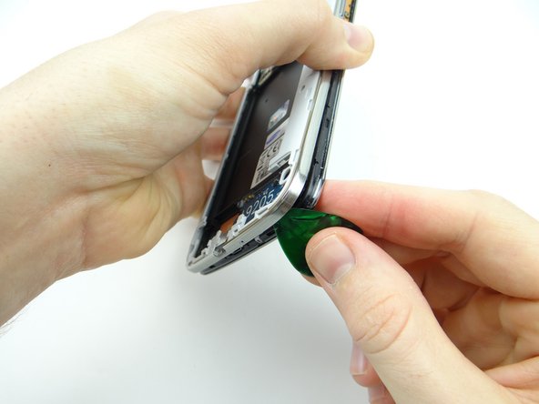 Pictures 1 &amp; 2: Work up the lower-right corner until you're able to wedge your fingers between the mid-frame and front panel.