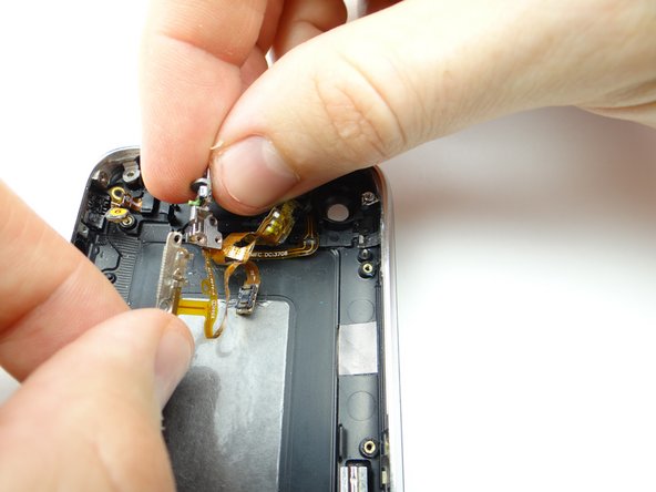 Picture 3: Peel the headphone jack, mute switch gear and volume buttons bracket right just enough to access the mute switch.