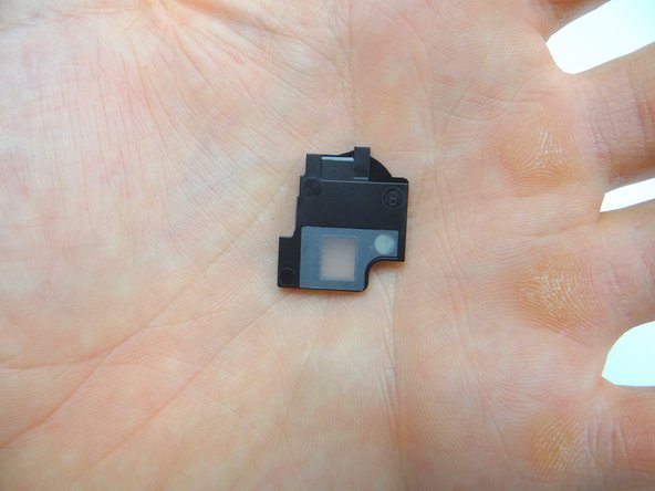 Pry up the speaker cover and place in COMPARTMENT D.