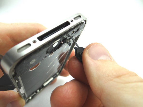 Carefully guide the ribbon cable through the mid-frame.