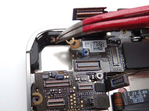 Picture 1: Replace Gold Grounding Clip from SLOT 8 with Curved Tip Tweezers. Be careful not to scratch the logic board with the tweezer