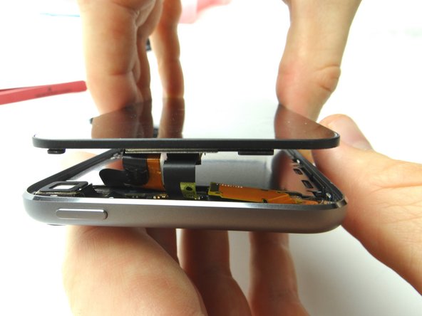 After reassembling an iPod, it is common to see a screen with lines down the LCD or a white screen.  Try turning it off and back on.  If that doesn't work, you may have to perform a soft reset. (press and hold power and home buttons simultaneously for ten seconds).