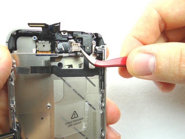 Remove front-facing camera plate and place in COMPARTMENT D.