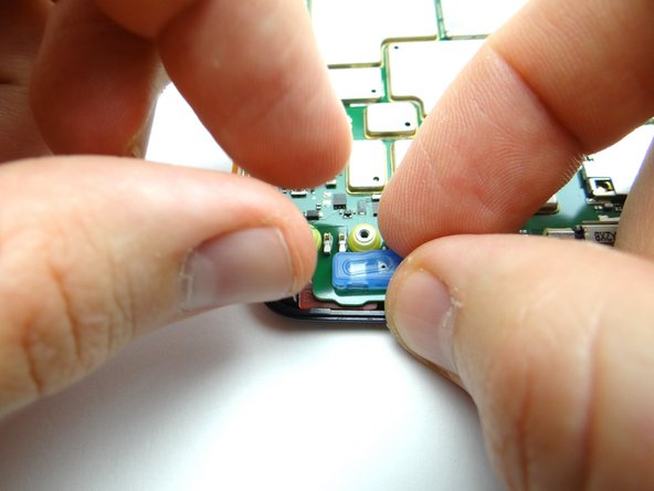 Picture 3: Remove blue microphone cover.  Place in COMPARTMENT B.