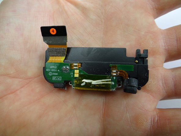 Place your index finger on the charging port as shown.  Pivot up and pull away to remove it.  Place in ZONE IV.