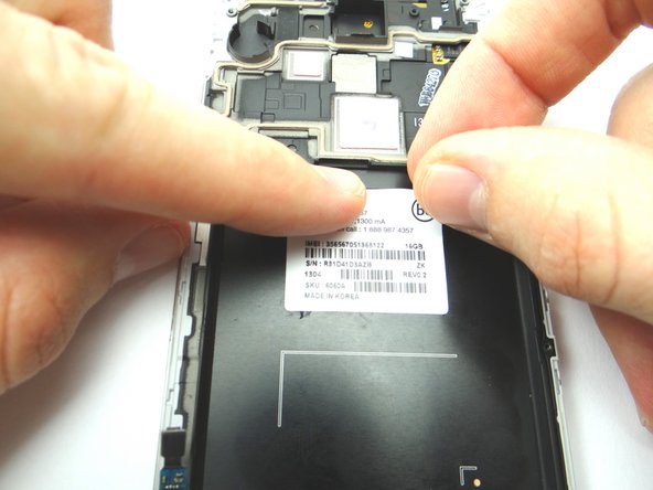Place the IMEI sticker on the new display assembly and smooth out with your fingers.