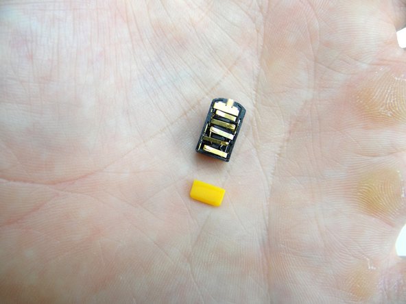 Place the headphone jack and yellow spacer in COMPARTMENT B.