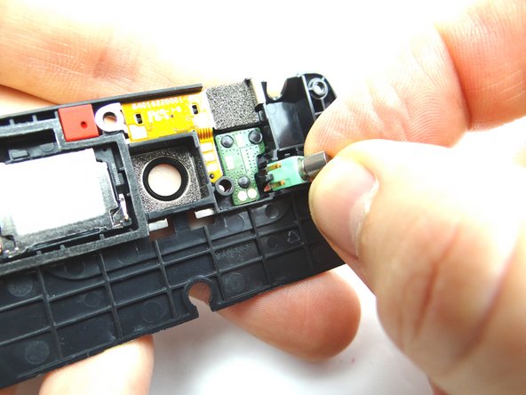 Picture 2: Carefully pull it out with your fingers after it's pried up.