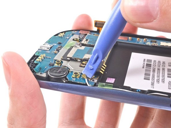 Picture 1: Use the Blue Pry Tool and disconnect the wifi antenna connector.