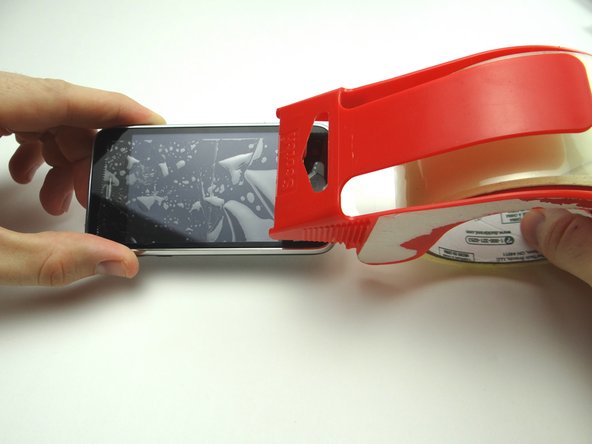 Picture 1: If you're replacing a cracked display, put a strip of packing tape across the screen.