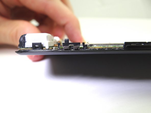 Pictures 1 &amp; 2: Note the orientation of the power button: line up the tabs on the power button with the corresponding slots on the front panel.