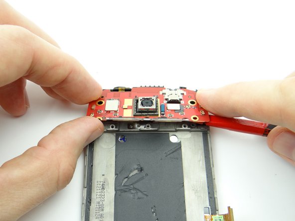 Don't try to remove the daughter board completely in this step.  The power button is still adhered to the front panel: