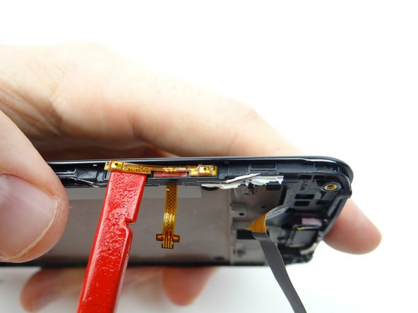 Picture 1: Use flat end of spudger to lift bottom of volume cable.