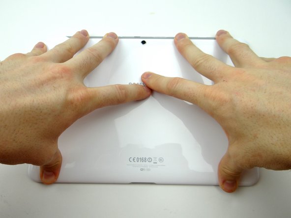 Picture 3: Turn tablet over and continue pressing clips into place.
