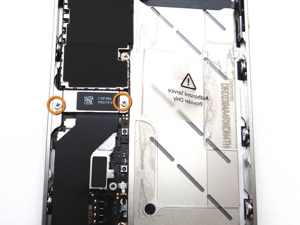 Replace the charging port assembly shield from SLOT 11.